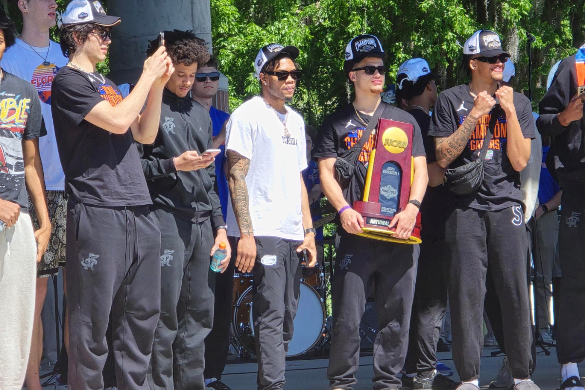 Walter Clayton Jr., the center point of the Gators team during the course of its championship run, holds the National Championship trophy.