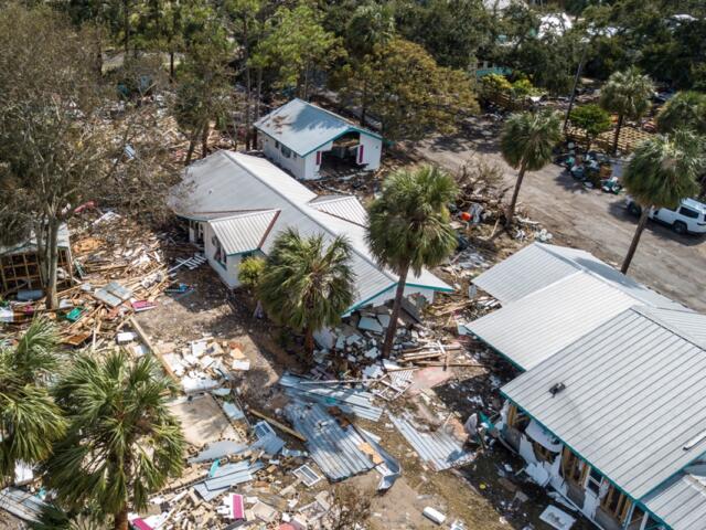Aerial view of storm-ravaged homes and debris scattered across Cedar Key, Florida, after Hurricane Helene.