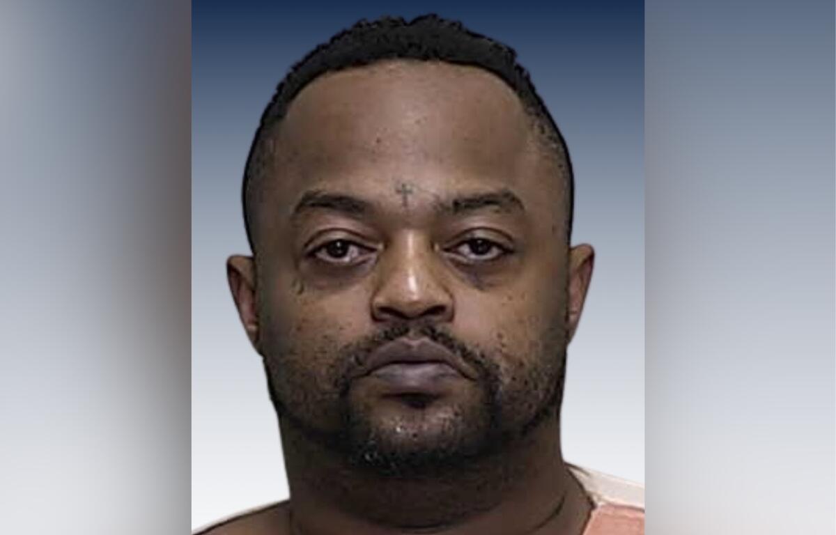 Mugshot of Stanley Summer Jr. wearing an orange prison uniform, facing forward with a neutral expression.