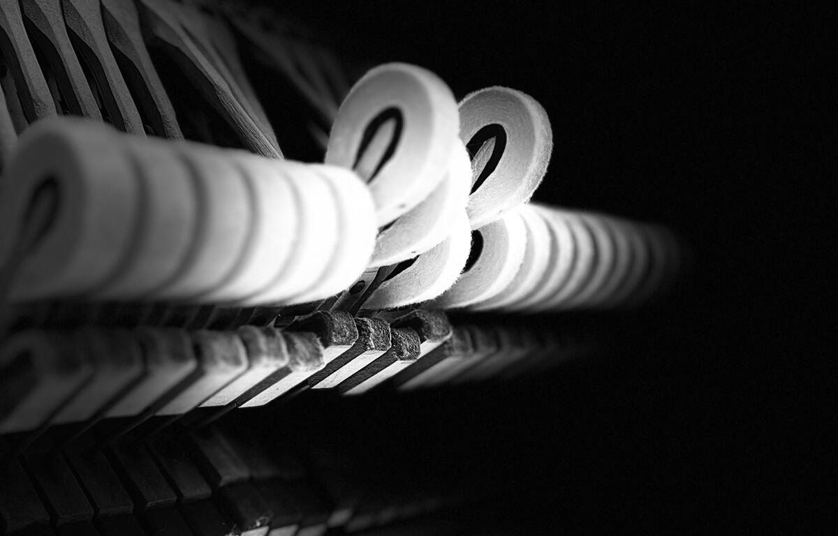 Close-up of piano hammers captured by artist David Kellner, featured in Melodic Metamorphosis at The Brick Gallery in Downtown Ocala.