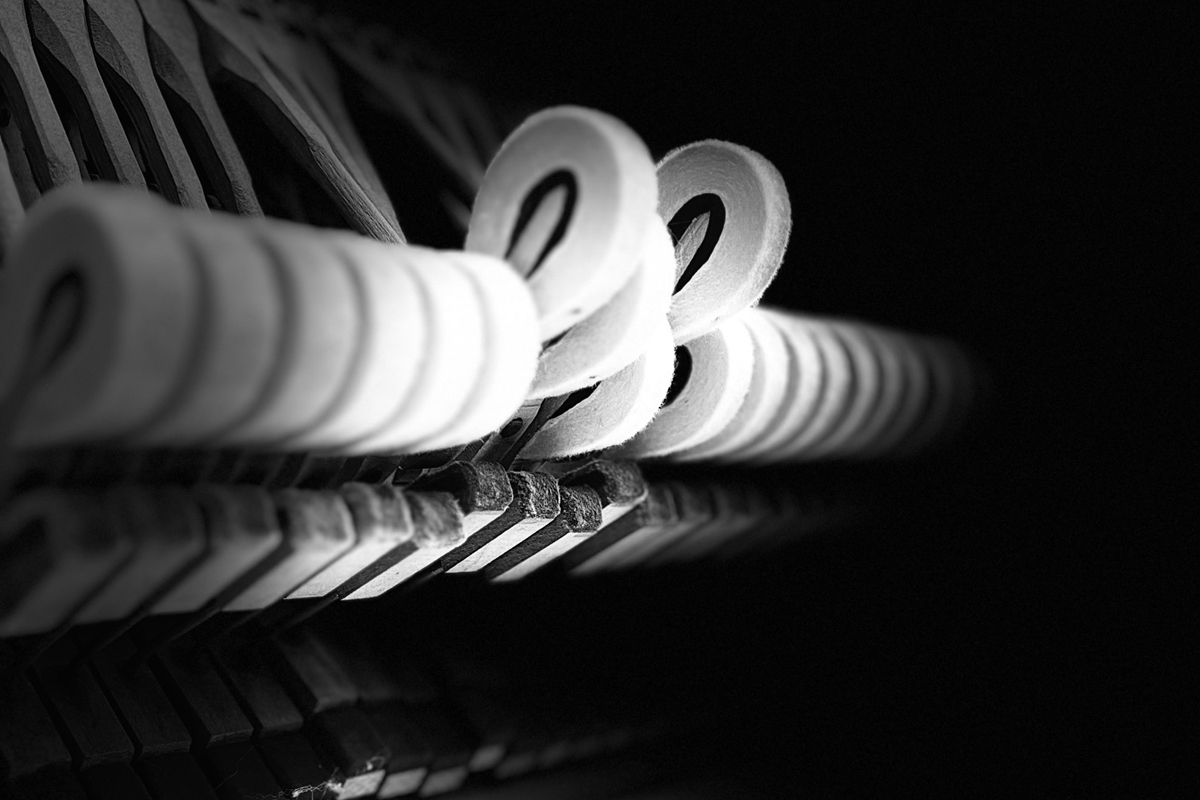Close-up of piano hammers captured by artist David Kellner, featured in Melodic Metamorphosis at The Brick Gallery in Downtown Ocala.