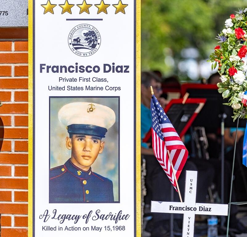 A tribute display honors USMC Pvt. First Class Francisco Diaz, who was killed in action during the Vietnam War, during the Memorial Day ceremony at Veterans Memorial Park in Ocala. [Photo courtesy of Marion County]