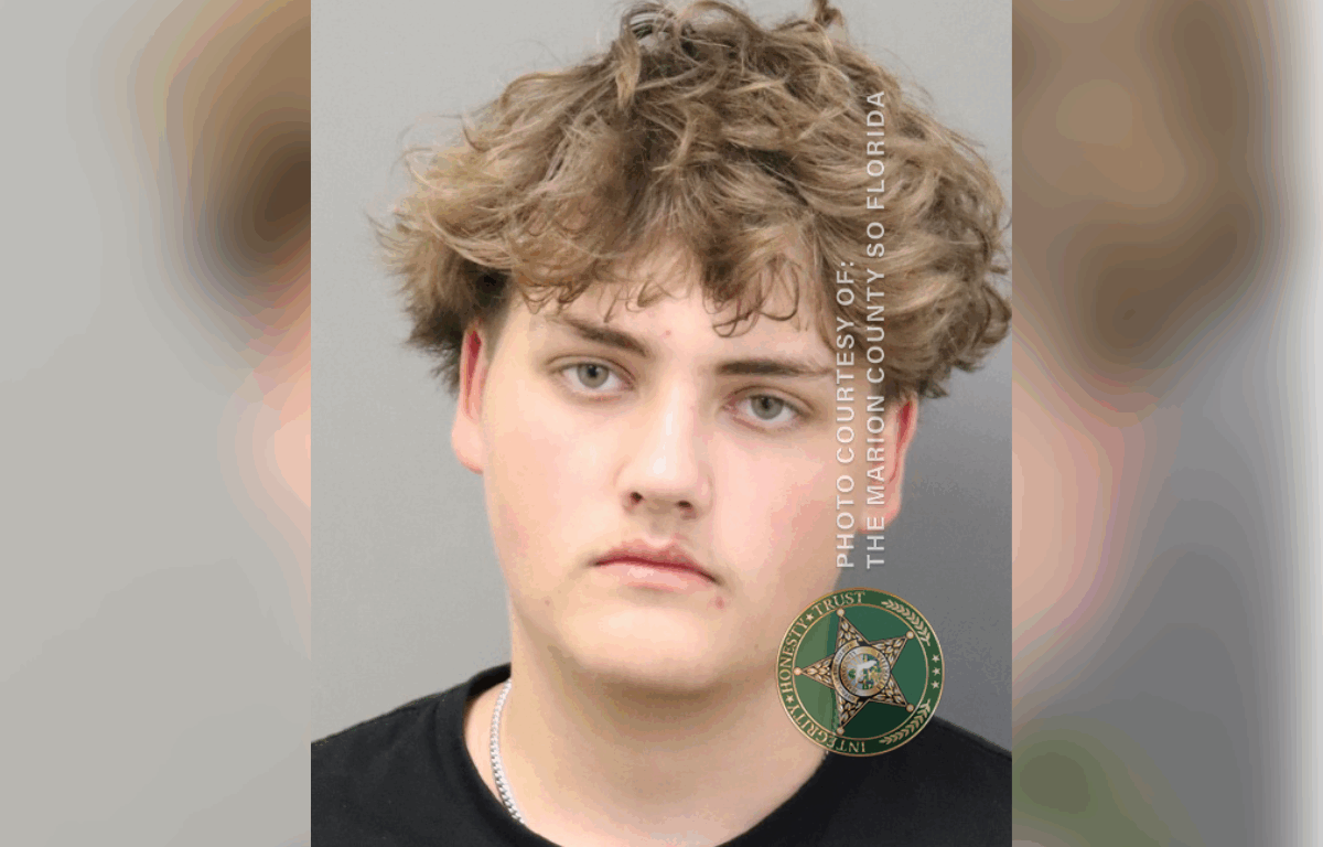 Mugshot of a teenage male with curly hair, wearing a black shirt, provided by the Marion County Sheriff's Office.