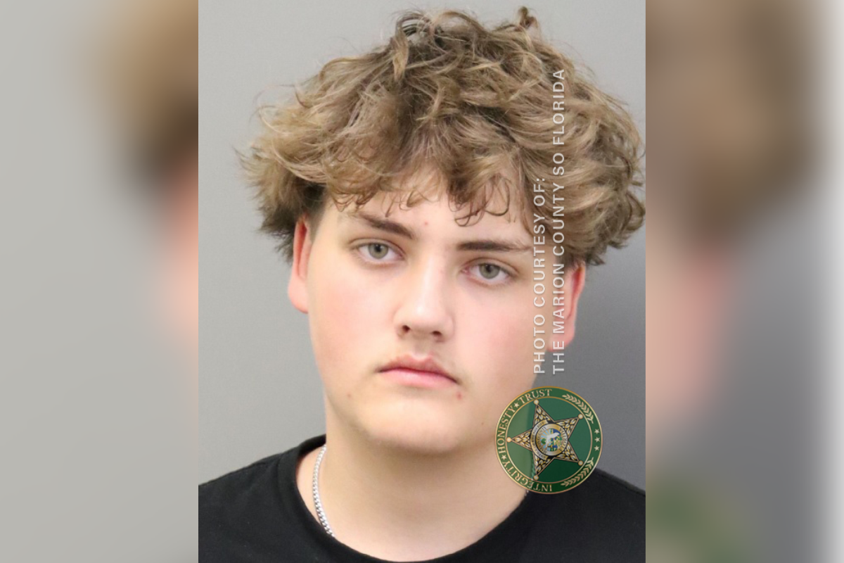 Mugshot of a teenage male with curly hair, wearing a black shirt, provided by the Marion County Sheriff's Office.