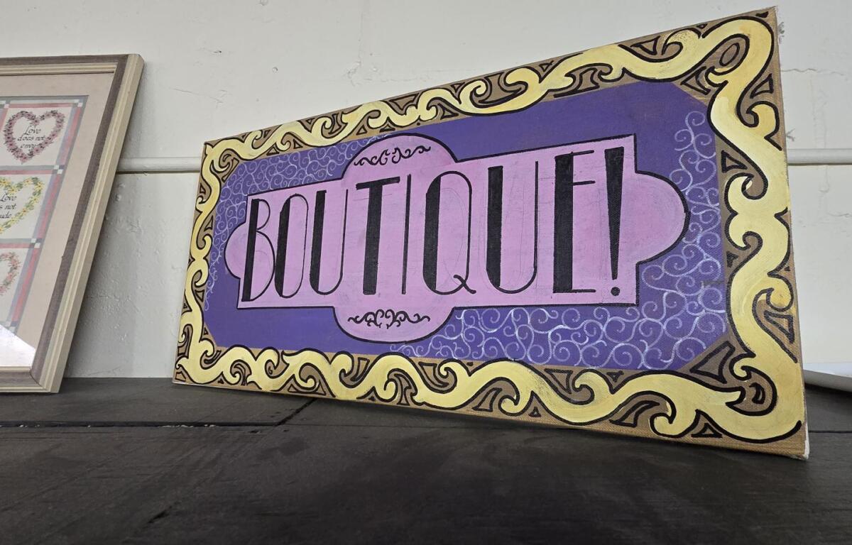 The boutique offered clothing to people in need of a shirt on their back.