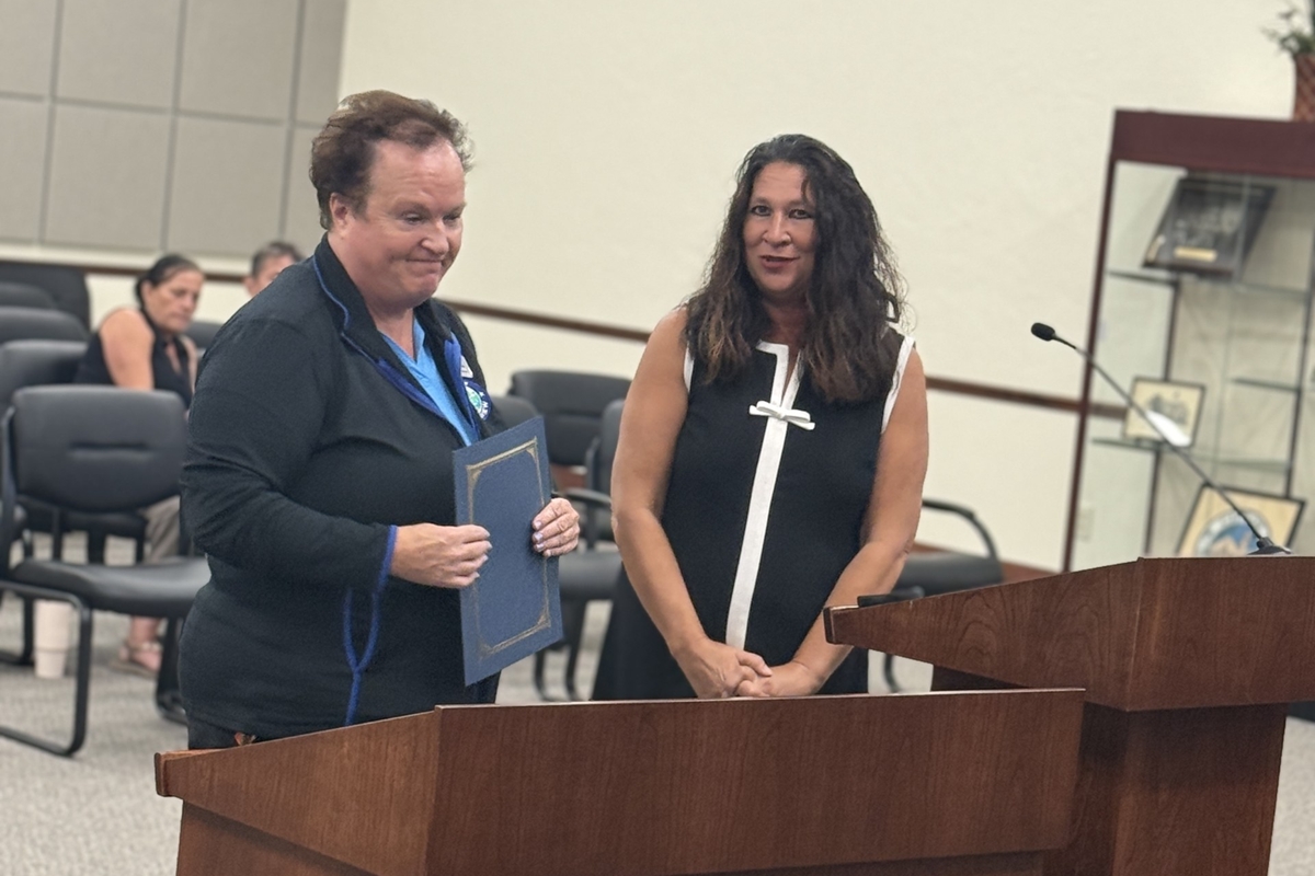 Lisa Byington receives a proclamation from Mayor Christine Dobkowski at a Belleview City Commission meeting.