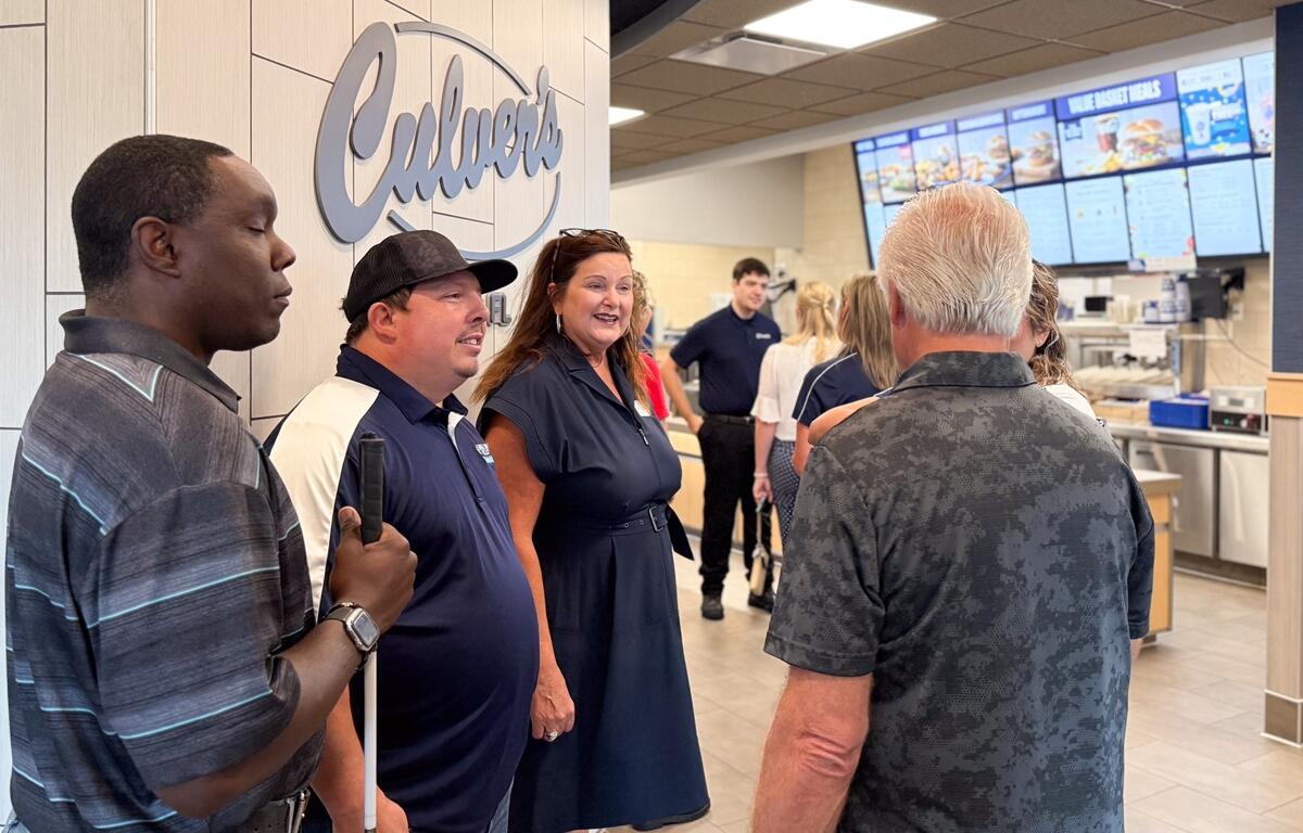 People chatting inside the newly opened Culver’s restaurant in Ocala during its ribbon-cutting event.