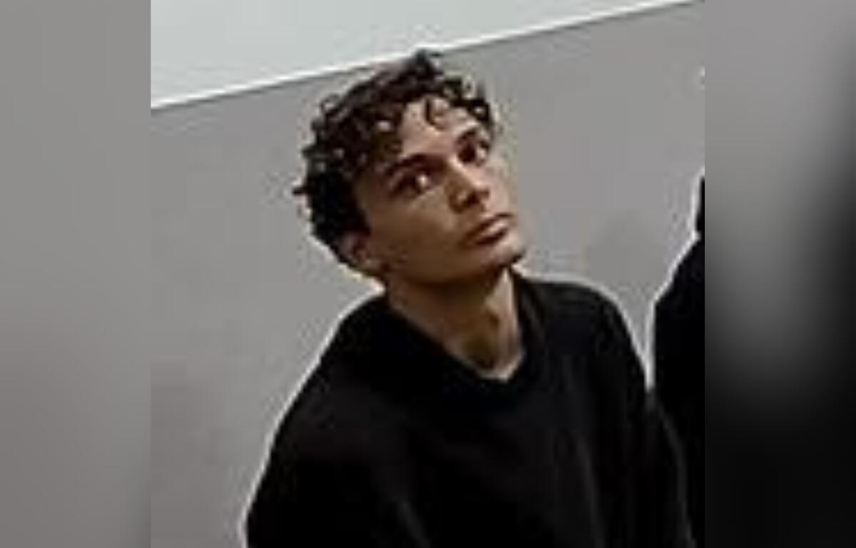 Missing teen Dante Sparrowhawk, 15, wearing a black hoodie, looking upward in a security camera image released by Ocala Police.