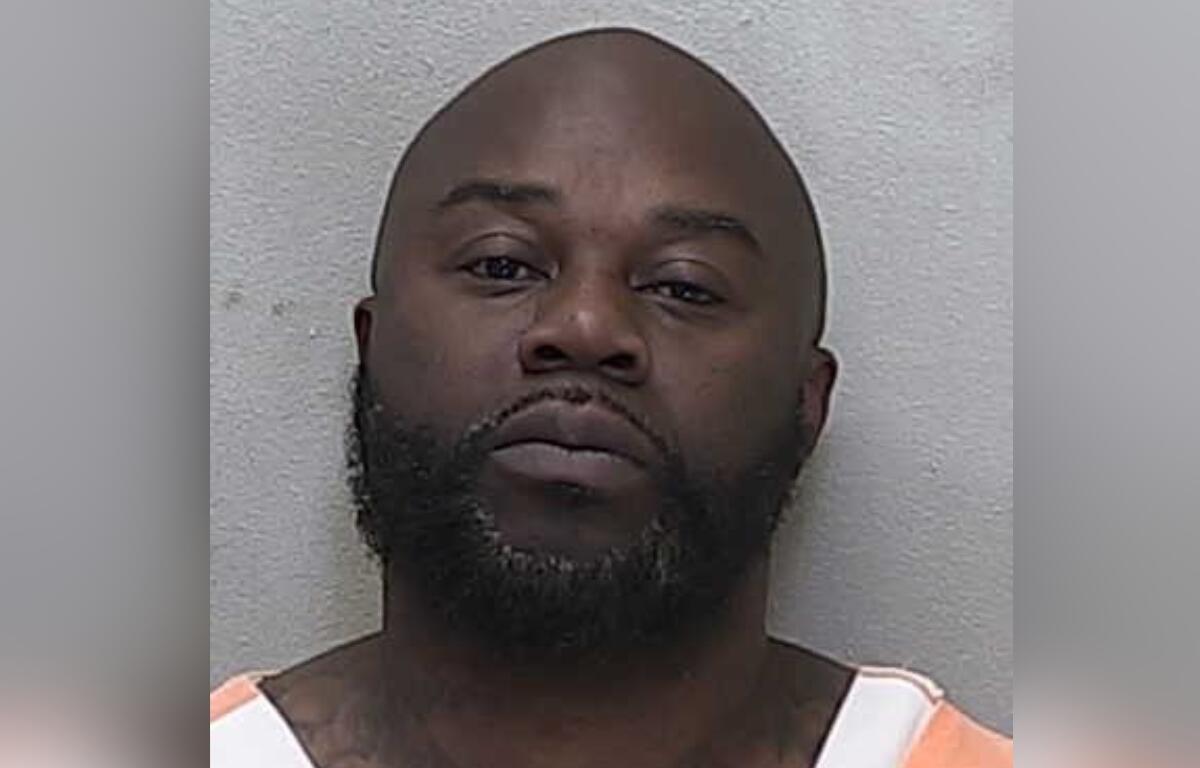 Mugshot of Harry Gregg following his arrest in Marion County, Florida, wearing a jail uniform.