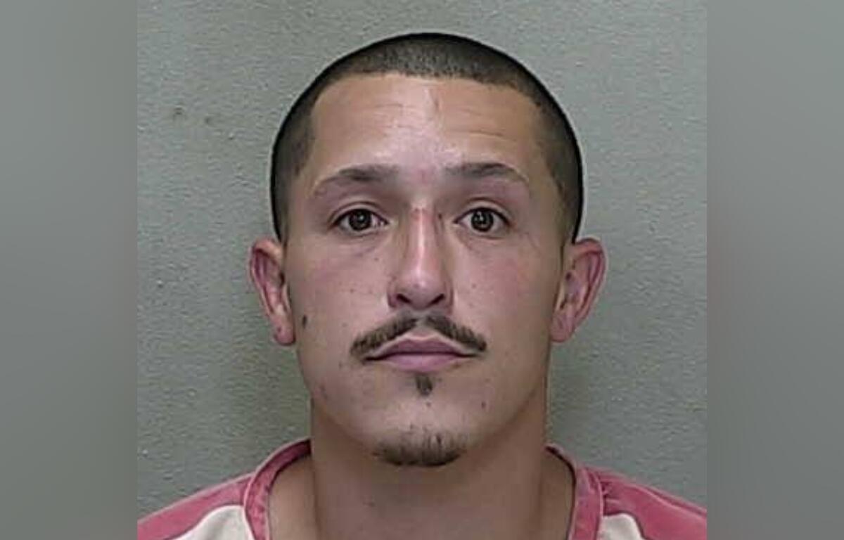 Mugshot of Jarred Michael Hunsberger, 32, wearing a red and white jail uniform, taken by the Marion County Sheriff’s Office.