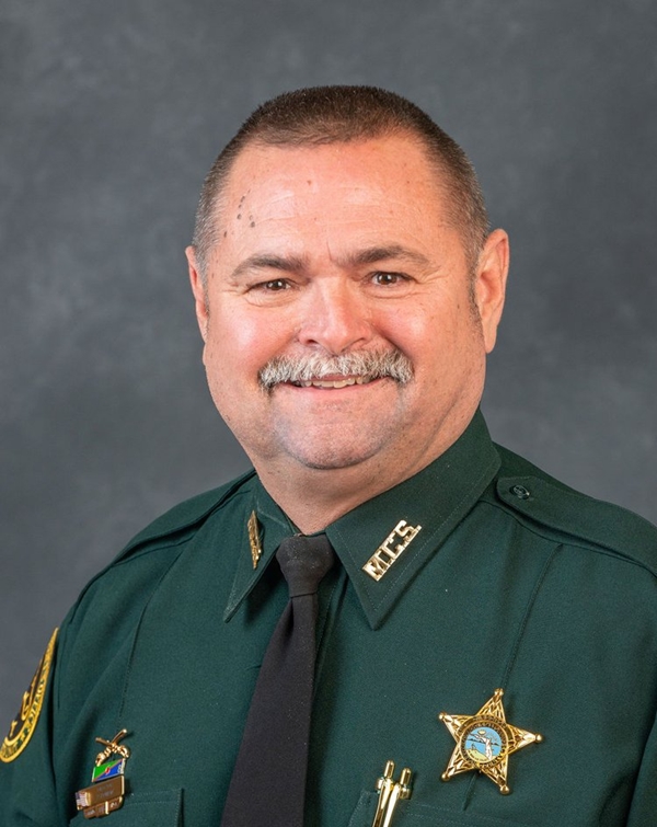 Preston Bowlin in official Marion County Sheriff’s Office uniform, smiling in front of a gray backdrop.
