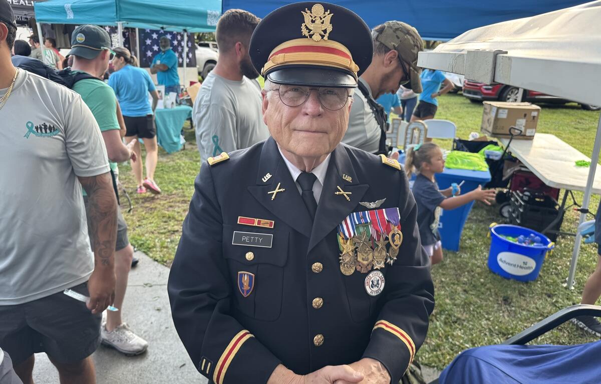Veteran Capt. Petty in full U.S. Army dress uniform with medals at the PTSD Awareness Walk in Ocala.