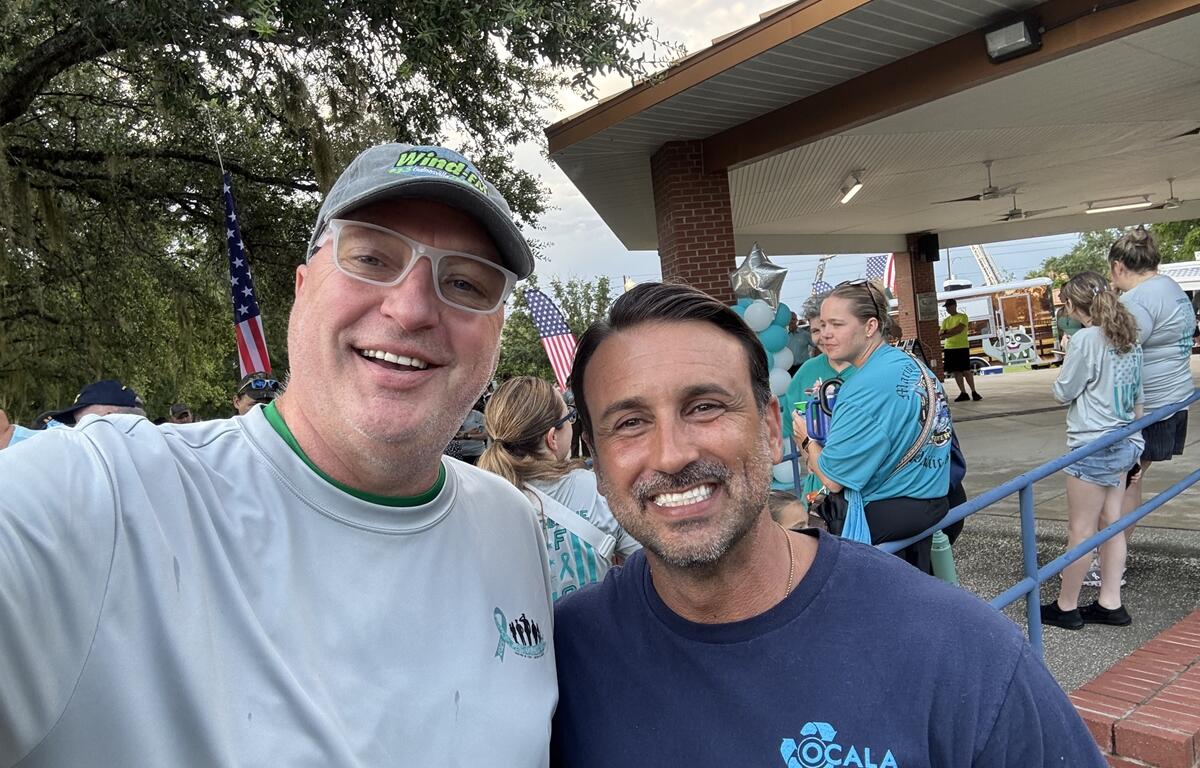 Scott Chase and Ocala Mayor Ben Marciano smile for a photo at the PTSD Awareness Walk in Ocala.