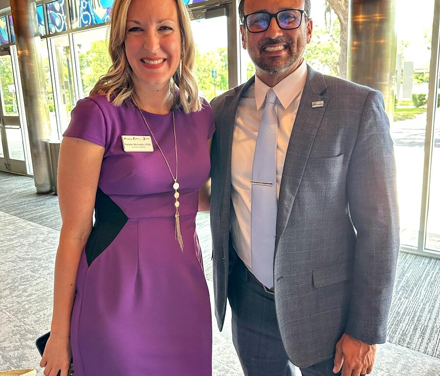Natalie McComb and Mayor Ben Marciano smiling together at the AdventHealth Mainstage dedication event.