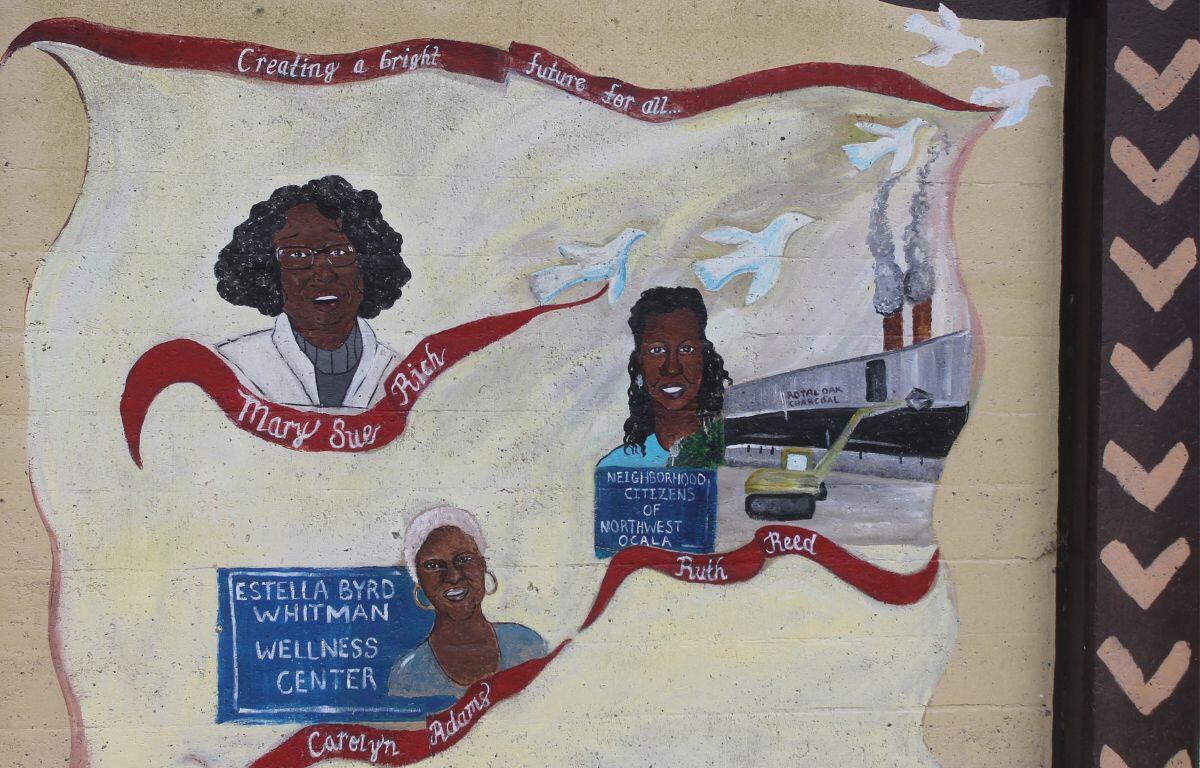 Three women are depicted with their names features on red ribbons underneath their images, with the one on the lower left, having writing on a chalkboard to her left, and the women at mid-right, having a blue bos with writing below her image, with a building to her right, with, doves flying against a white background.