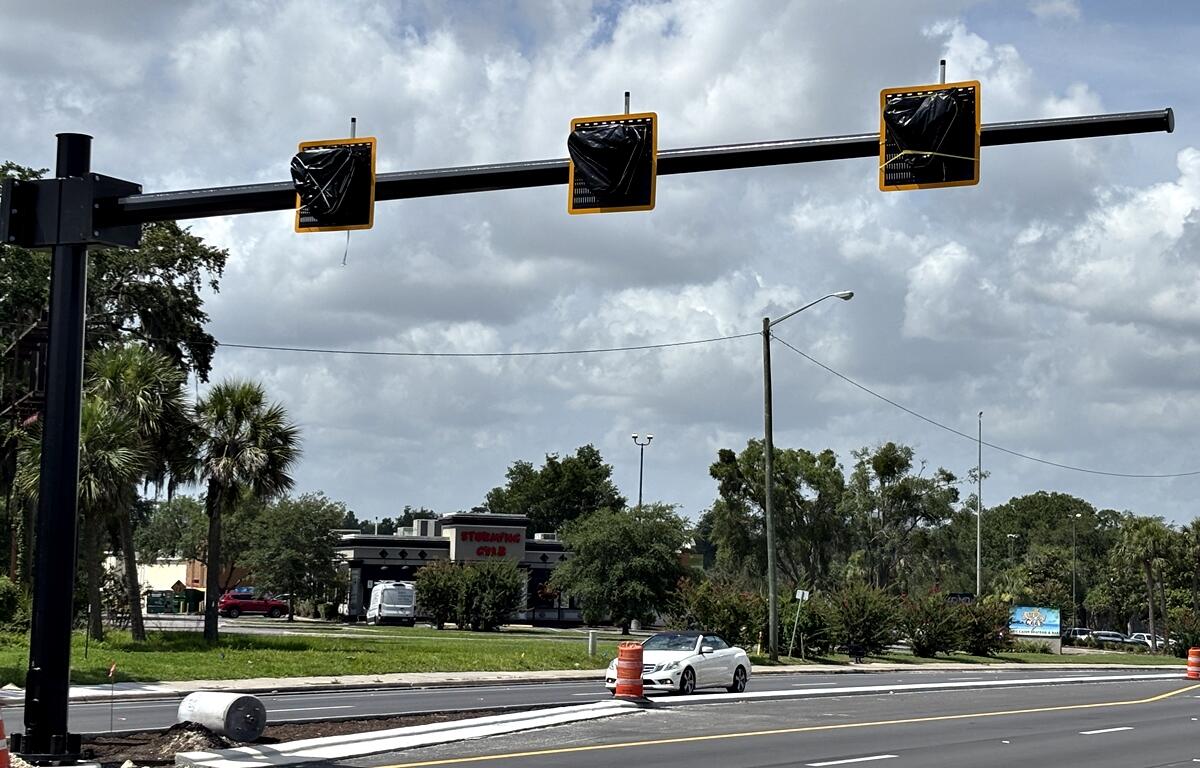 Covered pedestrian hybrid beacon signal installed over State Road 200 near Ocean Buffet in Ocala.