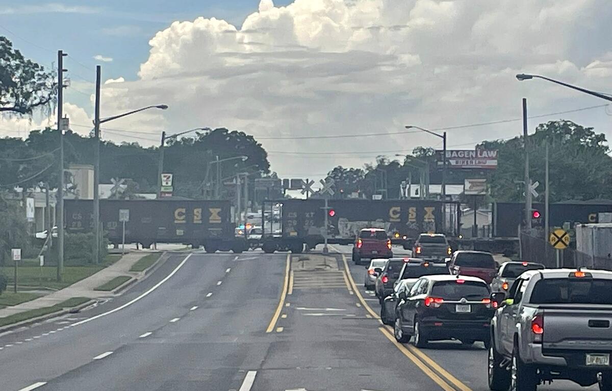 Traffic halted on NW 10th Street in Ocala due to a partially derailed CSX train blocking the road.