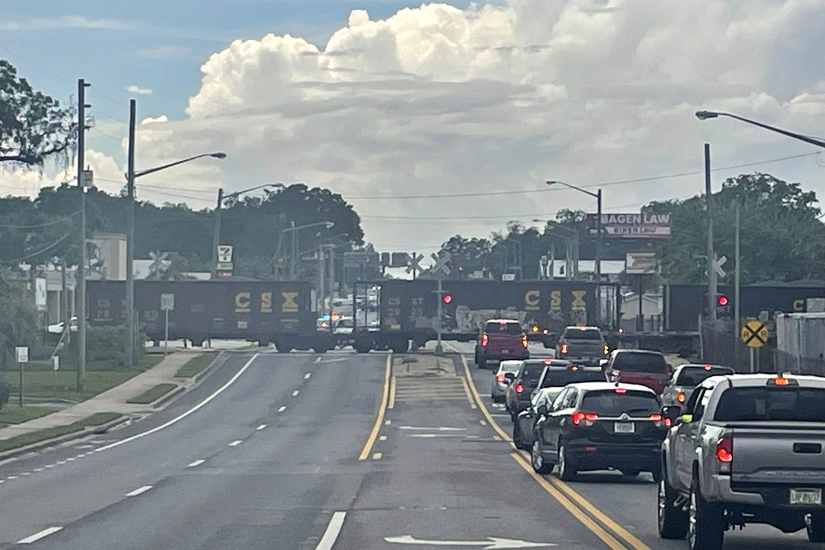 Traffic halted on NW 10th Street in Ocala due to a partially derailed CSX train blocking the road.