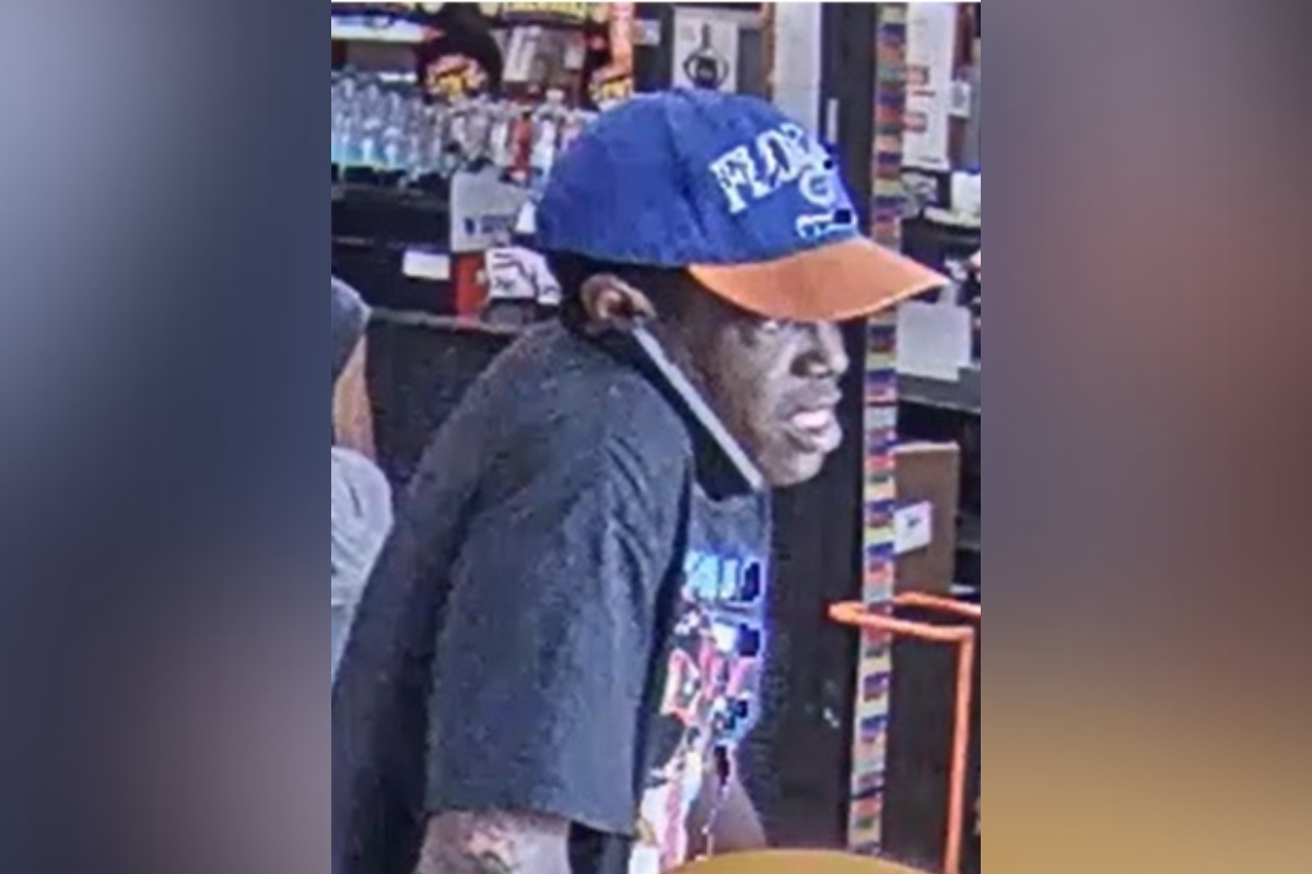 Surveillance image of theft suspect wearing a blue and orange Florida Gators cap inside Home Depot in Ocala.