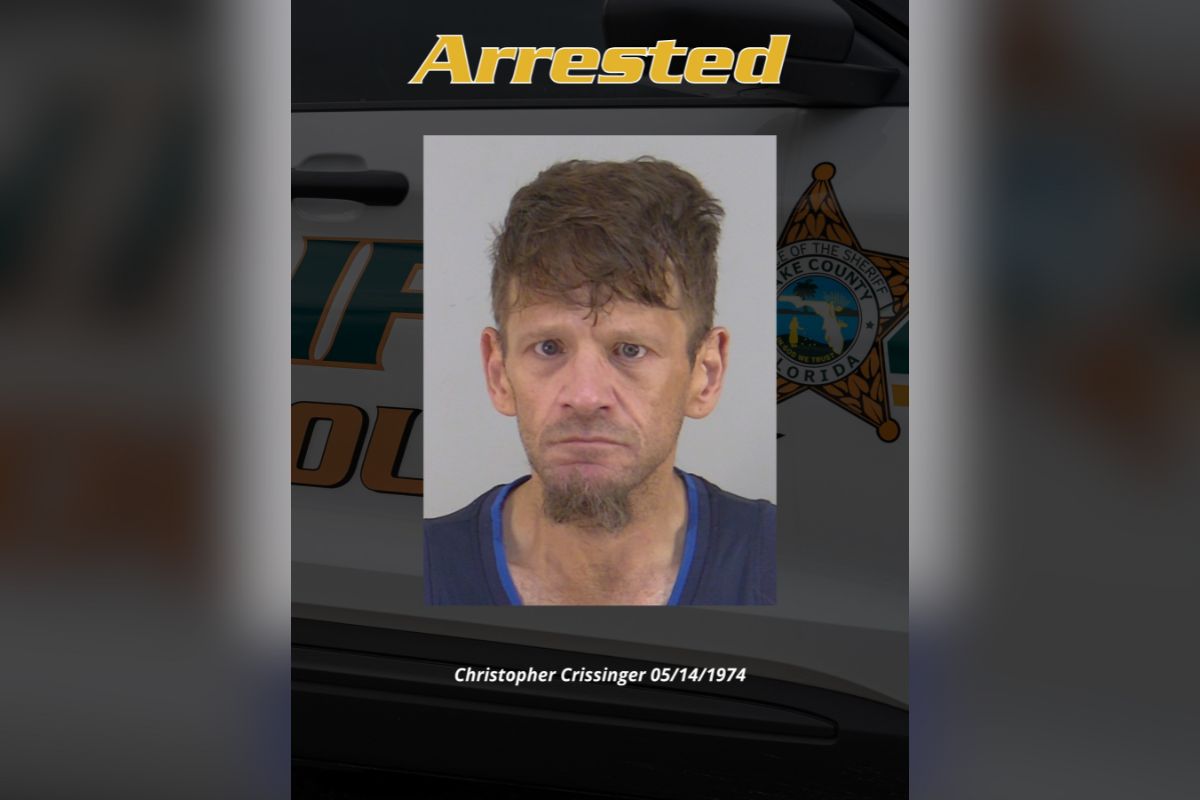 Image shows mugshot of man in center with text above which reads "Arrested" and the man's name and date of birth on a black background with a police car.