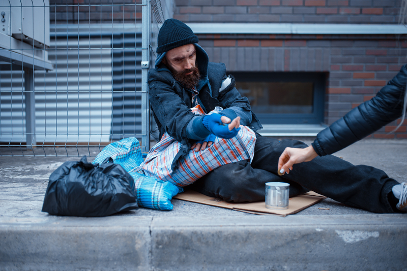 Homeless man on sidewalk