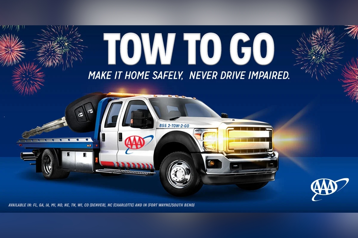 AAA Tow to Go promotional image with tow truck, large car key, fireworks, and service details.