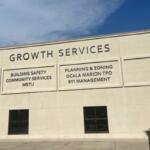 Marion County Growth Services building exterior with department names listed on facade.