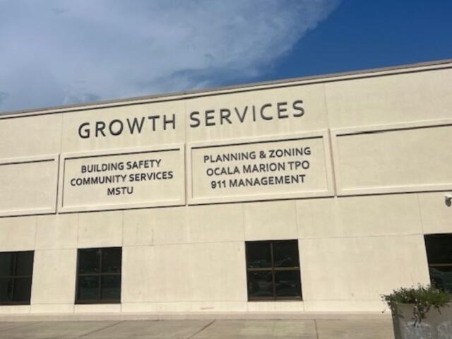 Marion County Growth Services building exterior with department names listed on facade.