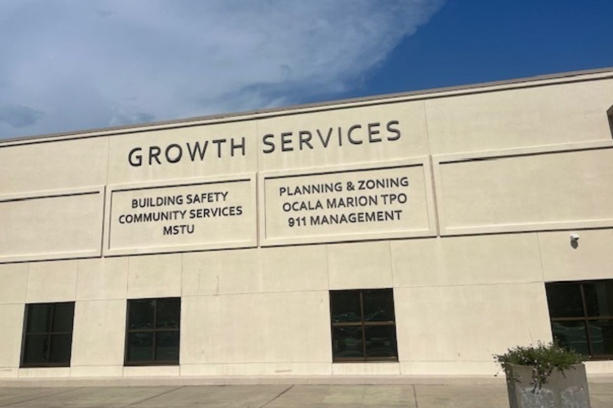 Marion County Growth Services building exterior with department names listed on facade.
