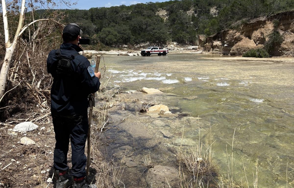 Task Force 8 member monitors floodwaters in Kerr County, Texas during search and rescue mission