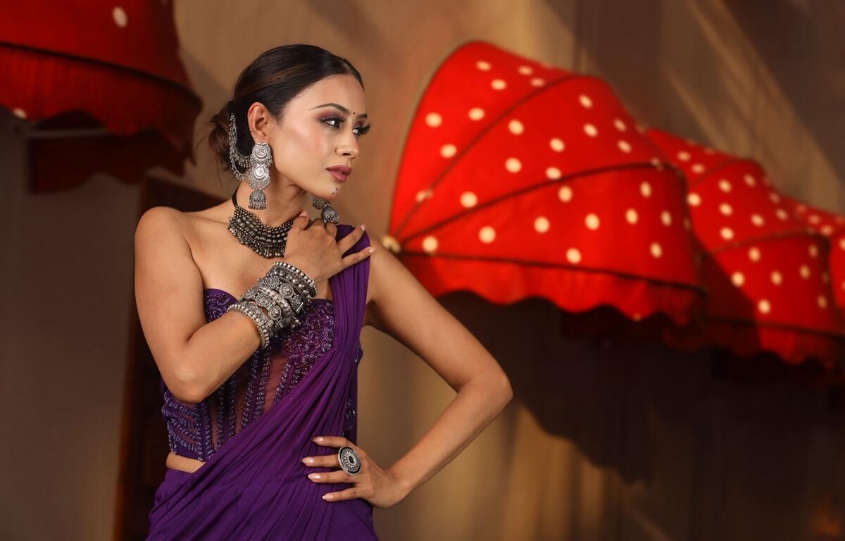 Nilam Patel showcases traditional Indian attire and jewelry during the cultural segment of the Mrs. India Worldwide pageant in Dubai.