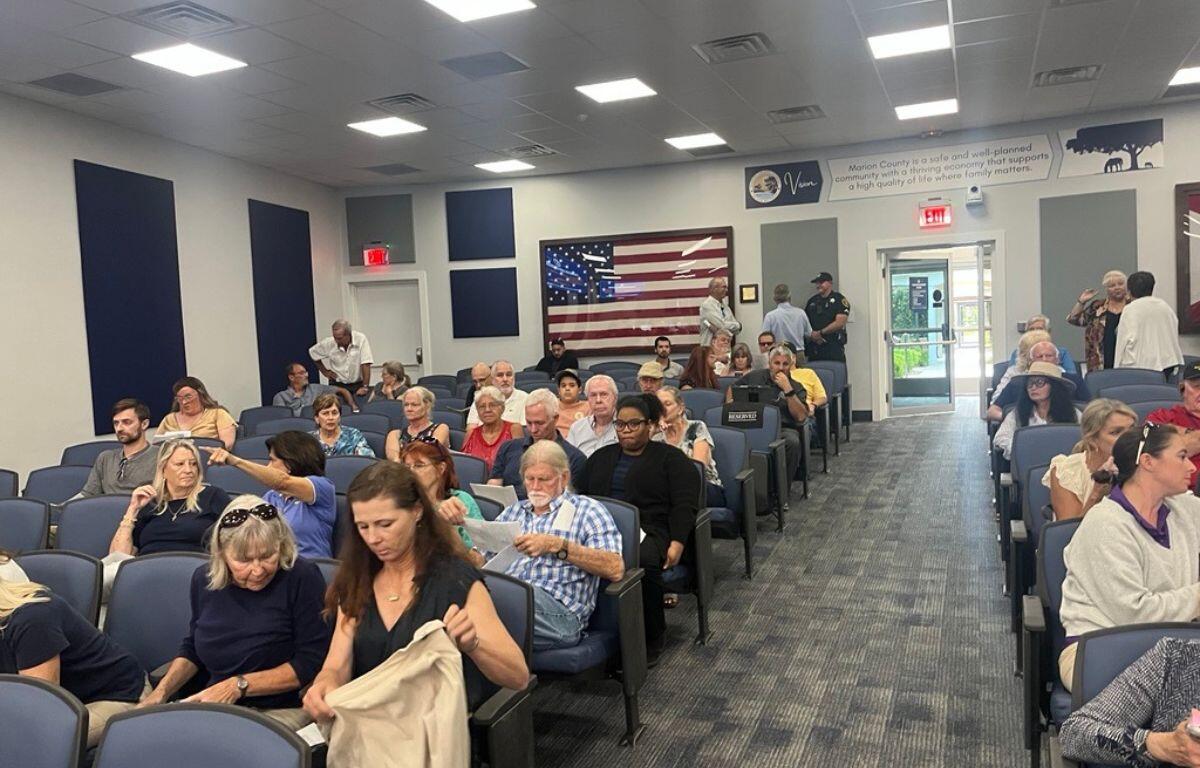 Community members seated in a meeting room during a Marion County Planning and Zoning Board public hearing.