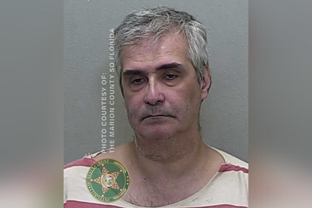 Mugshot of Roberto Maurizio Stracuzzi, a 56-year-old man with gray hair, wearing a striped jail uniform, arrested by Marion County Sheriff's Office.