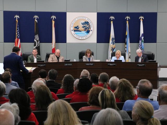Marion County commissioners and audience during a public hearing.