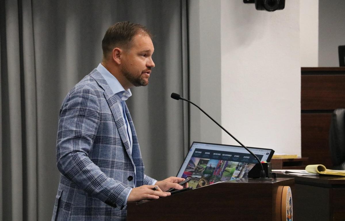 Matt McClain speaks at a podium during a Marion County Commission hearing.