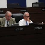 Matthew Minter and Mounir Bouyounes seated at the commission dais during a Marion County hearing.