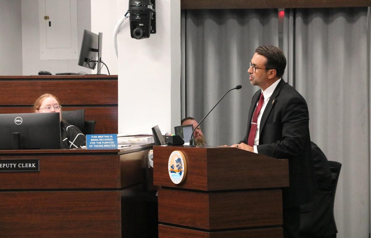 Ben Marciano speaks at a podium during a Marion County Commission meeting.