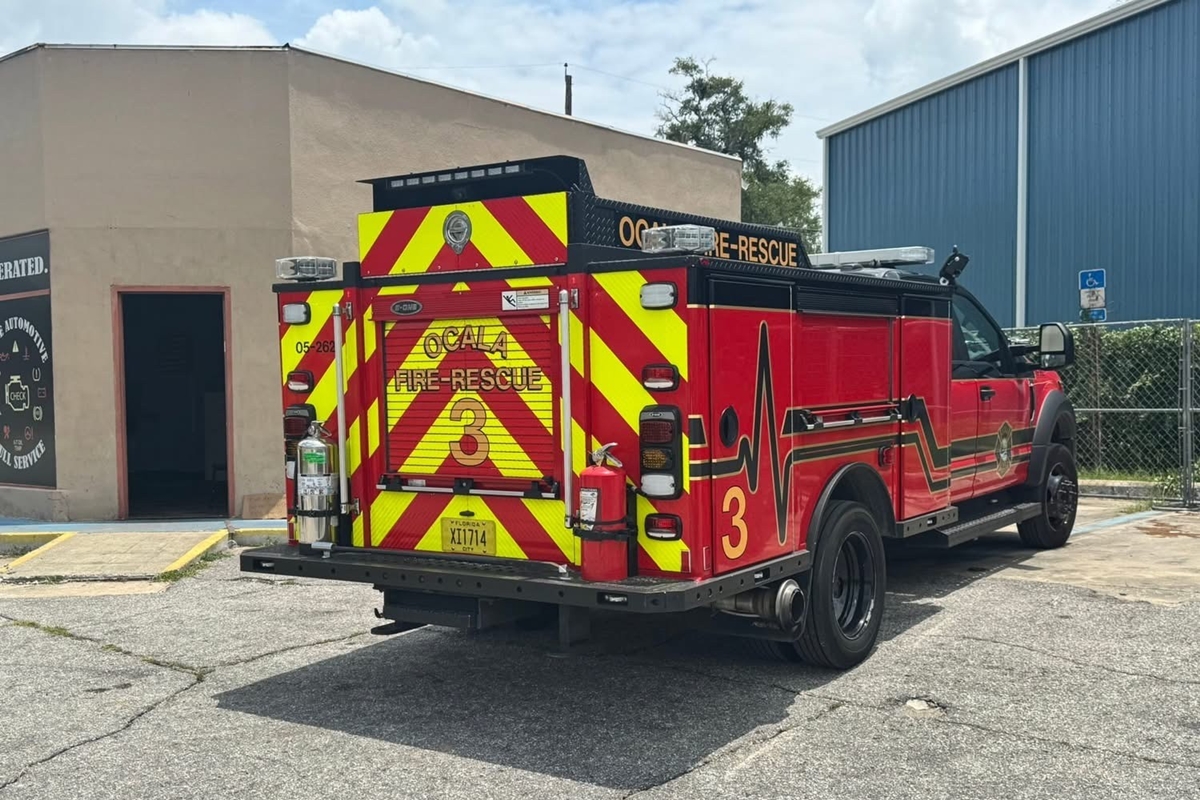 Ocala Fire Rescue Truck 3 parked outside tan commercial building during firefighter training
