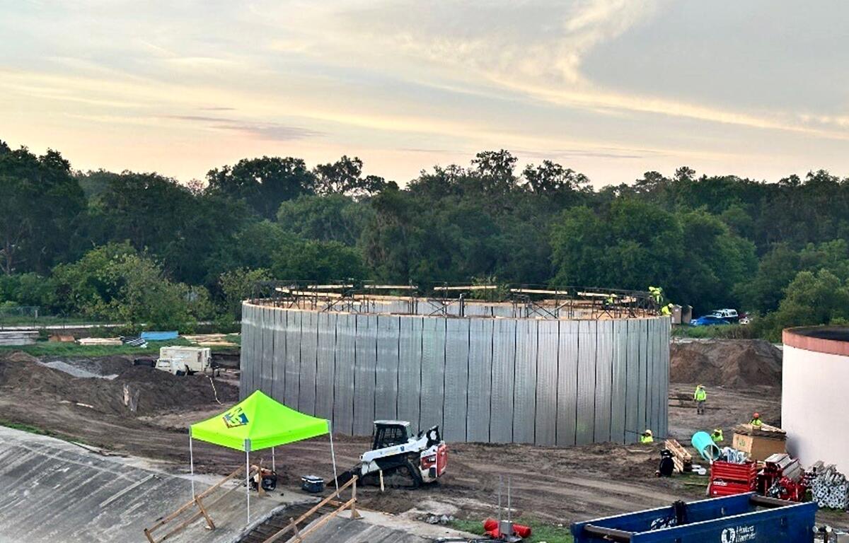 Construction site of Belleview Wastewater Treatment Plant Expansion with workers and equipment.