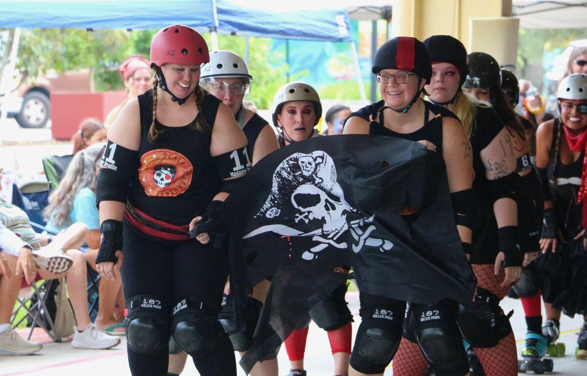 Small group of Pirates skaters in costume.