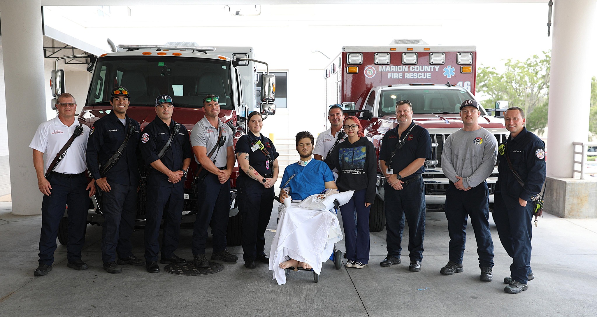 Max Gagnon stands with the Marion County Fire Rescue team who pulled him from the wreckage of his truck after a life-threatening crash.