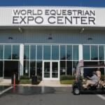 Exterior of the World Equestrian Center Expo Center with event signage above entrance.