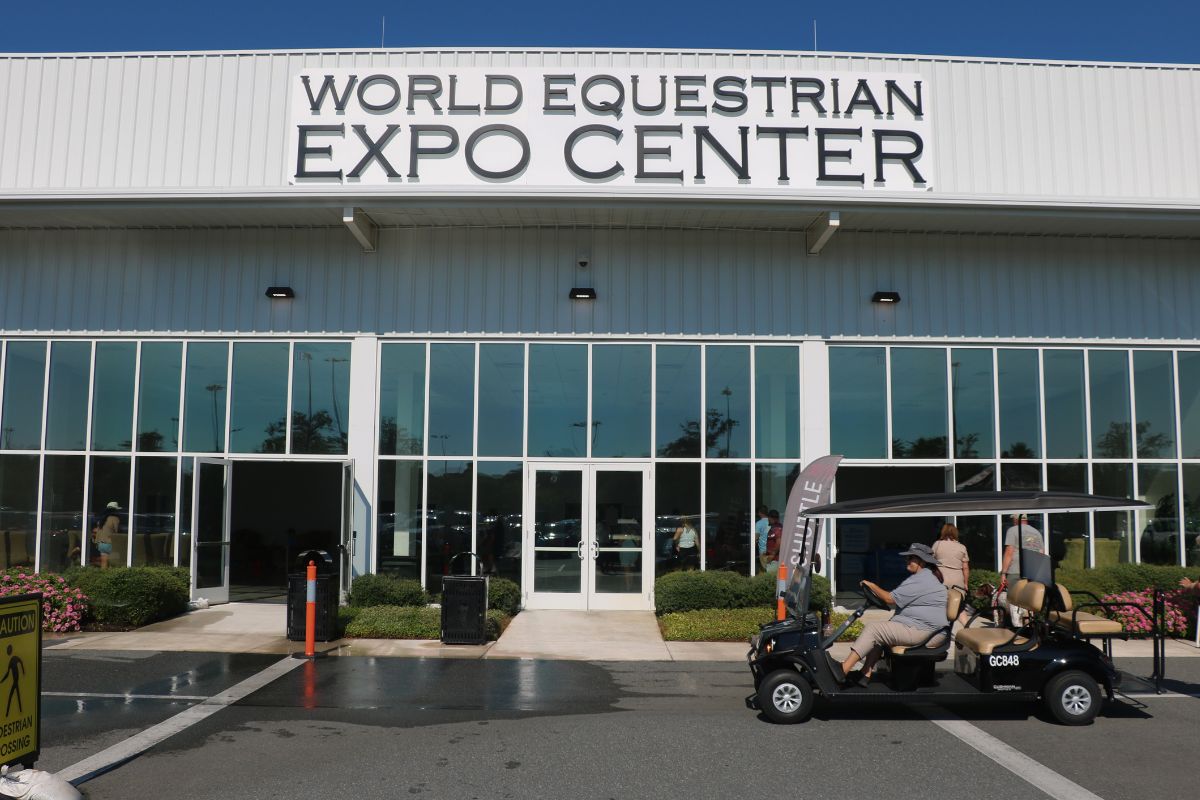 Exterior of the World Equestrian Center Expo Center with event signage above entrance.