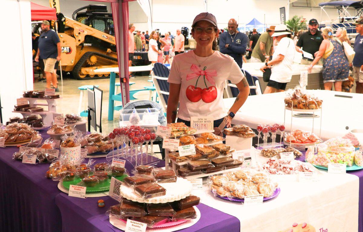 Table display filled with baked goods and pastries at a local vendor booth.