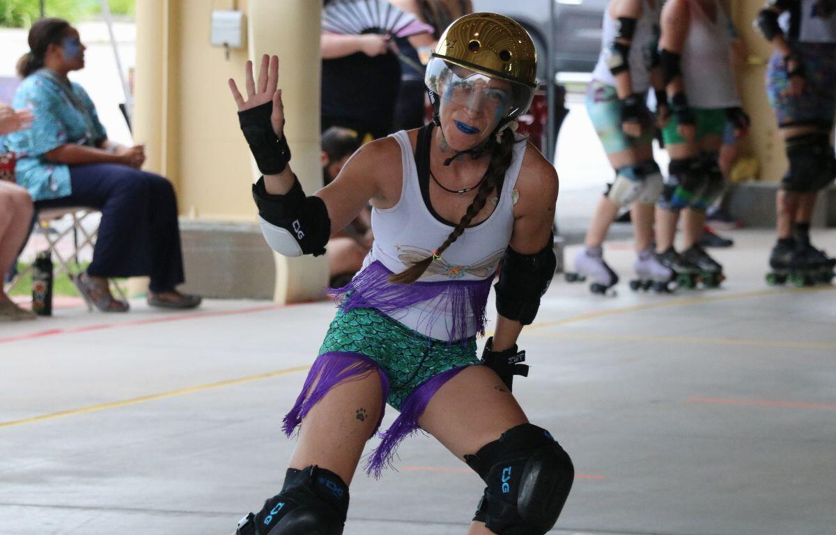 A skater from the Mermaid team posing for a photo while on the move.