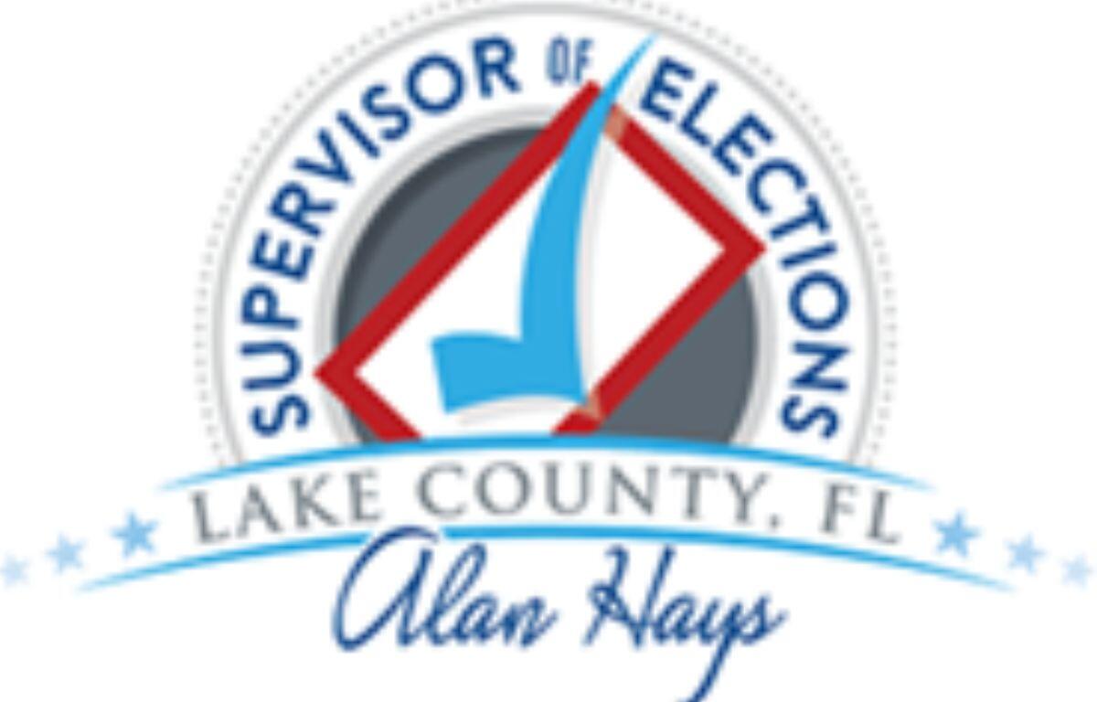 A circular logo, with lettering and a giant check mark and a signature at the bottom of the logo.
