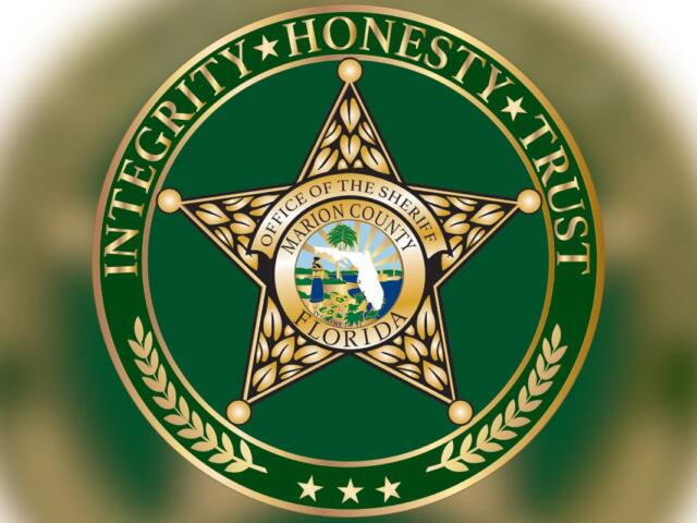 Circle, and inside the circle lettering, and then a badge with lettering and an insignia, with a green background inside the circle.