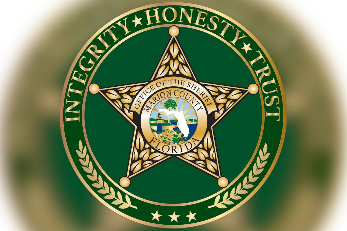 Circle, and inside the circle lettering, and then a badge with lettering and an insignia, with a green background inside the circle.