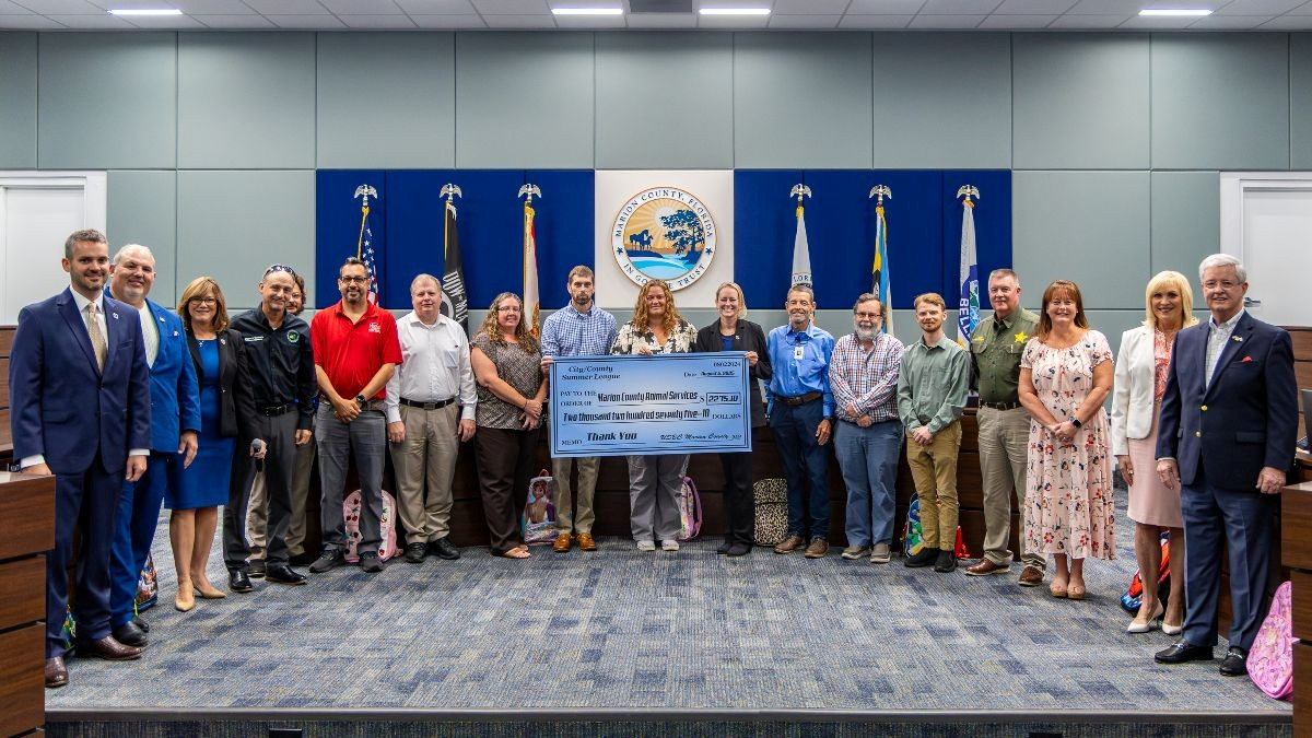 The Marion County Board of County Commissioners join Members of the City/County Bowling League as they present a big donation check to the Marion County Animal Services team.