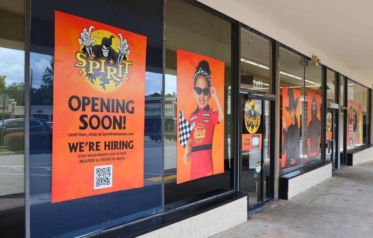 Entrance of the Spirit Halloween store in East Ocala with bright banners and signage.